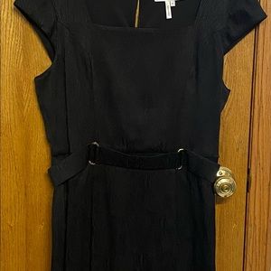 Black dress fit for any occasion. With belt, to the kneecap, new with tag.